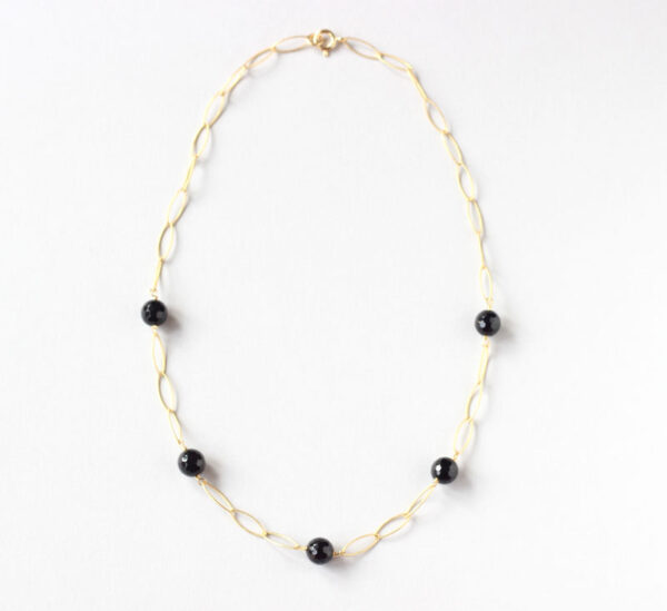 image of gold chain necklace with black onyx stone